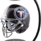 A Tennessee Titans football helmet is levitating between the top and bottom sections of a curved stand.